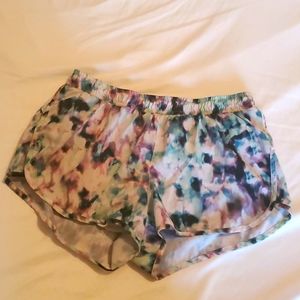 Teal, lavender, and white water colored athletic shorts